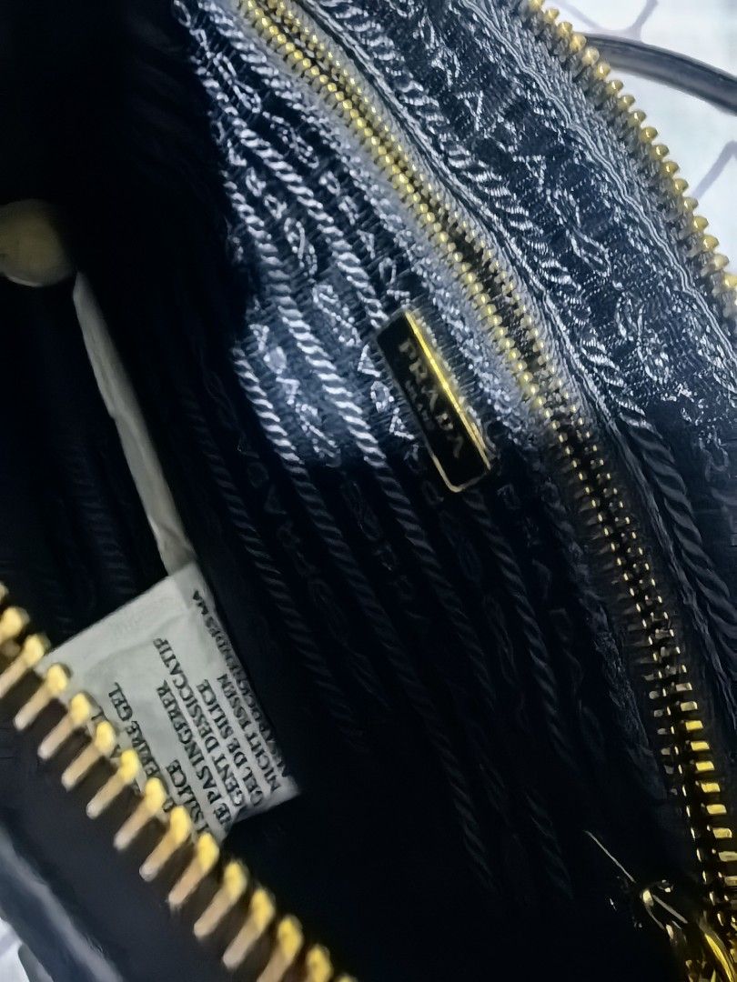 Prada Black Ruched Chain Shoulder Bag (Category: Luxury Bags & Wallets) located in Taguig. Submitted by undet27 (Listing ID 1460535936, Image 2). Description: - Authentic Black Prada Bag - Elegant Ruched Detailing - Luxurious Gold Chain Strap with Leather Accents - Iconic Prada Logo Emblem - Versatile Accessory for Any Occasion - Approx. Dimensions: [Insert Dimensions Here].