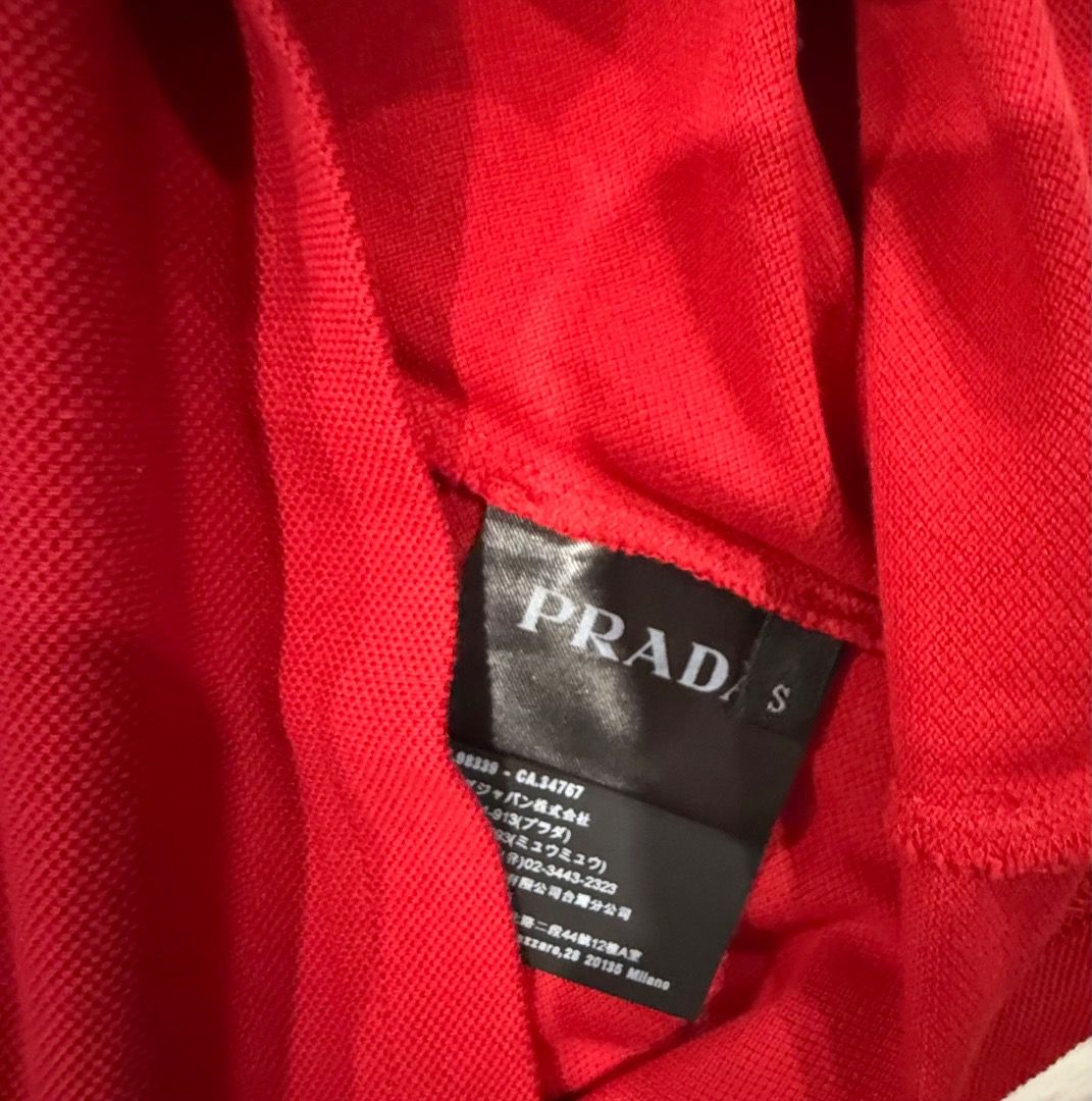 Prada Red Polo Shirt Size S (Category: Tshirts & Polo Shirts ) located in Quezon City. Submitted by ilabluxe (Listing ID 1460538665, Image 2). Description: - Authentic Prada Polo Shirt - Vibrant Bright Red Color - Classic Prada Logo Tag on Chest - Striped Detail on Collar - Short Sleeves with Striped Cuffs - Size: S - Ideal for Casual Wear 100% Authentic or Money Back Guarantee.