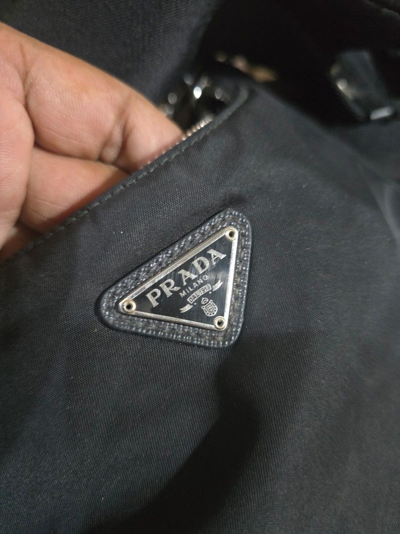 Prada Re-Nylon Mini Bag with Pouch (Category: Luxury Bags & Wallets) located in Davao. Submitted by arvinaboab04229 (Listing ID 1460559173, Image 2). Description: - Authentic Prada nylon bag - Includes matching mini pouch - Adjustable strap for comfortable wear - Secure zipper closure - Interior features Prada branding - Made in Italy and China - Ideal for carrying your daily essentials - inclusion Dustbag .