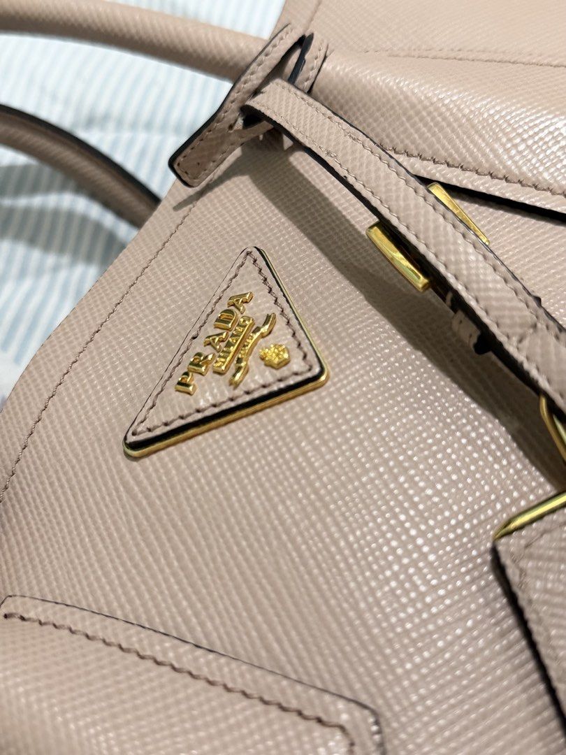 Prada Saffiano Cuir Small Double Bag (Category: Luxury Bags & Wallets) located in Manila. Submitted by lady_inde1988 (Listing ID 1460560879, Image 3). Description: - Authentic Prada Tote Bag - Made with genuine Saffiano leather - Features a detachable tag - Elegant gold hardware details - Very spacious interior - Ideal for everyday use or travel - Comes with authenticity card, dust bag, and enthruphy. .