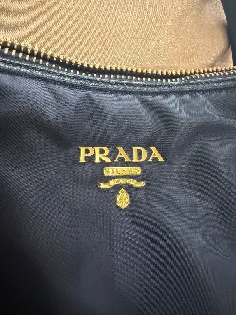 Prada Tessuto Nylon Navy Blue Bag (Category: Luxury Bags & Wallets) located in Makati City. Submitted by staraby (Listing ID 1460709918, Image 3). Description: - Authentic Prada Tessuto Nylon Bag - Color: Navy Blue - Versatile: Ideal for everyday use, work, or special occasions - Includes original dust bag - Comes with authenticity card - A classic and stylish Prada piece.
