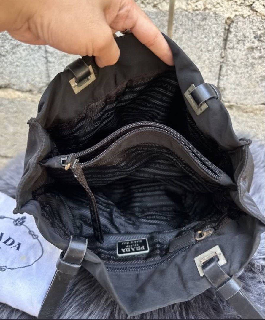 Prada Tessuto nylon Shoulder bag (Category: Luxury Bags & Wallets) located in Batangas. Submitted by stopandshopforluxury (Listing ID 1460713723, Image 2). Description: Guaranteed Original 💯 No flaws, can send more photos upon request. What you see is what you get. **GOLD CHAIN IS NOT INCLUDED** - add 480 if you want to include the chain. Shipping via Lalamove, J&T, and LBC Disclaimer: This is a preloved bag. Actual condition is shown in photos.