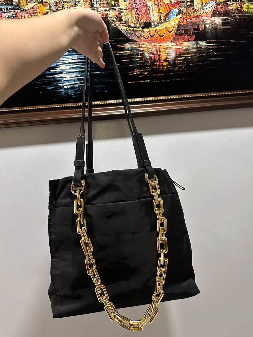 Prada Tessuto nylon Shoulder bag (Category: Luxury Bags & Wallets) located in Batangas. Submitted by stopandshopforluxury (Listing ID 1460713723, Image 1). Description: Guaranteed Original 💯 No flaws, can send more photos upon request. What you see is what you get. **GOLD CHAIN IS NOT INCLUDED** - add 480 if you want to include the chain. Shipping via Lalamove, J&T, and LBC Disclaimer: This is a preloved bag. Actual condition is shown in photos.