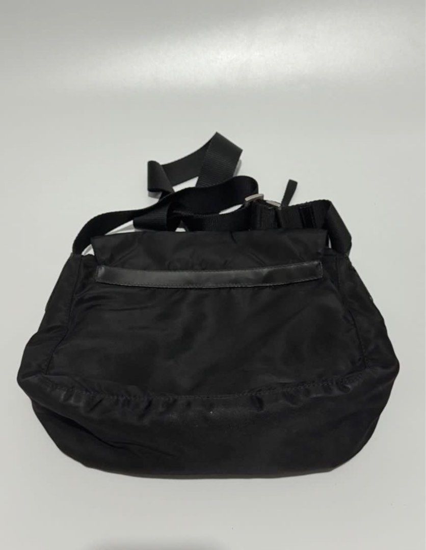 Prada Tessuto Sling bag (Category: Luxury Bags & Wallets) located in Batangas. Submitted by stopandshopforluxury (Listing ID 1460633545, Image 2). Description: Guaranteed Original 💯 With coa already Bag has a repaired part as seen on the photo, aside from that super goods na ng bag. And selling this very low compare with the other seller and Rank A bag. Bag is usable, walang mapuputol, walang dapat alalahanin dahil inayos na sa Mr. Quickie ☺️ ga