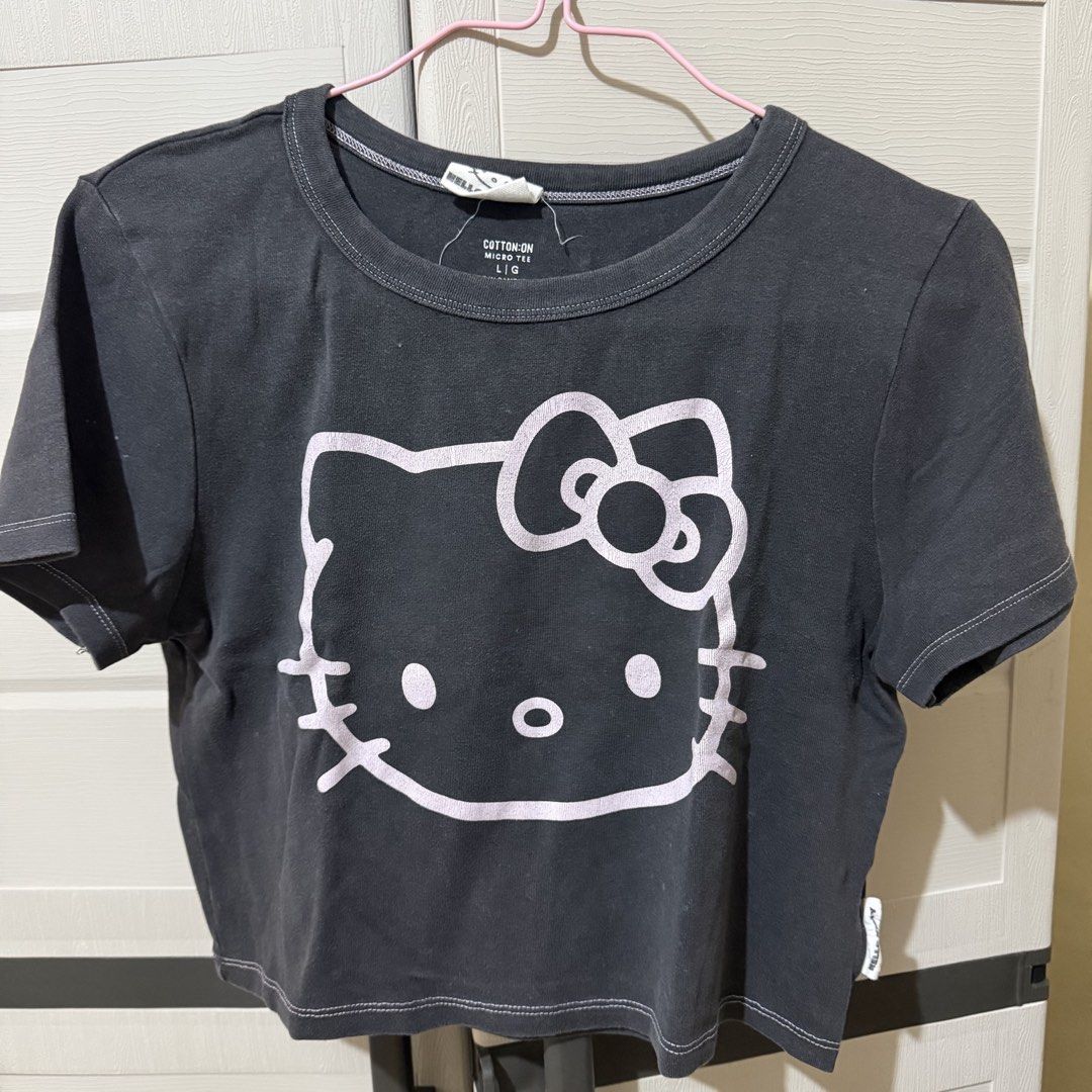 [Preloved] Cotton On x Hello Kitty Micro Tee (Category: Shirts) located in Manila. Submitted by ultsaida (Listing ID 1460709181, Image 1). Description: Cotton On x Hello Kitty Cropped Top Shirt – Size: L | Can fit M-XL – Condition: Like new – Wore twice only. – Preloved, manage your expectations. MOD: J&T / LBC (Buyer's preference and buyer will shoulder the shipping fee) MOP: Gcash, Maribank, or BDO Loc: Bataan.