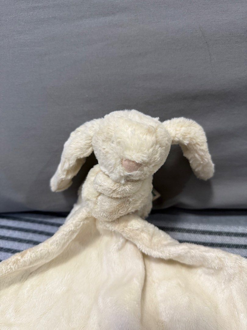 Preloved Jellycat Bunny Comforter Blanket (Category: Bedding & Towels) located in Manila. Submitted by kunehoe (Listing ID 1460543188, Image 2). Description: - Cream colored bunny comforter - Super soft and cuddly - Plenty of life left for a new little one to enjoy!.