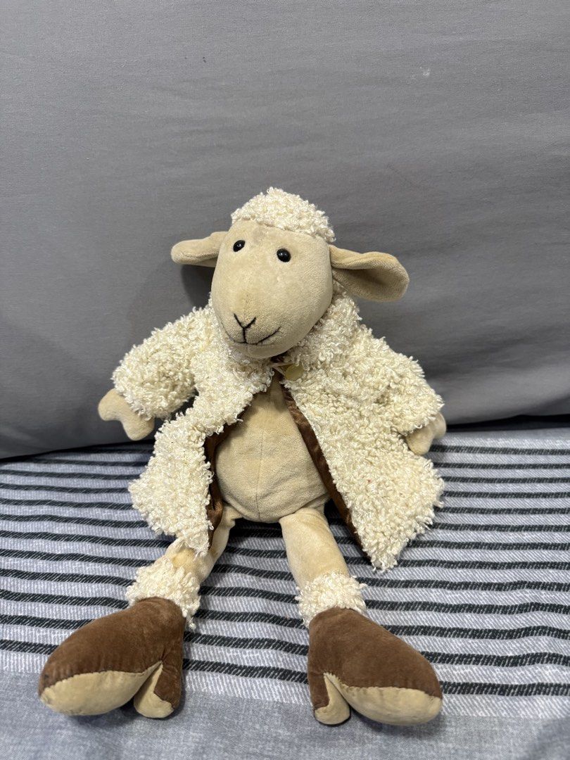 Preloved Jellycat Sheep Plush Toy (Category: Plushies & Soft Toys) located in Manila. Submitted by kunehoe (Listing ID 1460543381, Image 1). Description: - Adorable Jellycat sheep plush toy - Features a fluffy cream jacket and brown boots - Highly detailed design - Ideal for children and collectors alike - Approximately 12 inches in height.