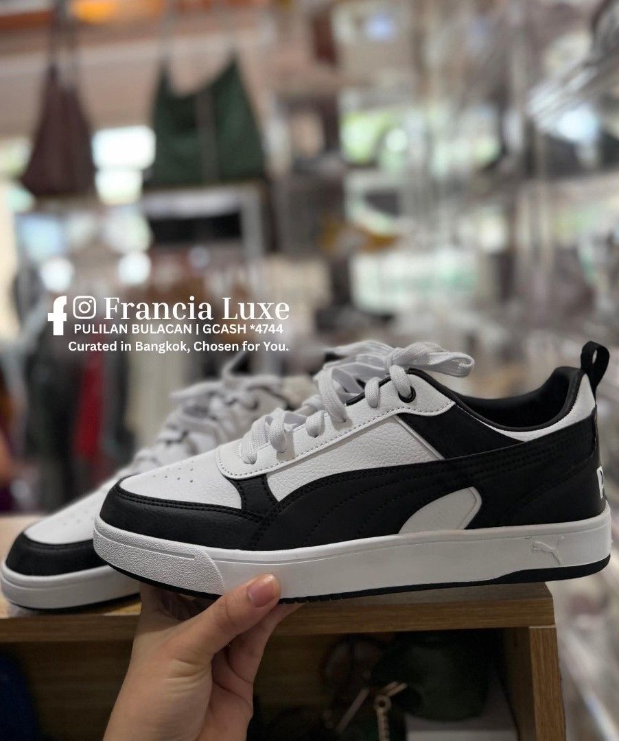Puma Black and White Sneakers (Category: Sneakers) located in Bulacan. Submitted by francia.luxe_237 (Listing ID 1460595335, Image 2). Description: - Authentic Puma sneakers in black and white - Low-top design - Lace-up closure - Iconic Puma logo on heel and side - Ideal for everyday wear - Comfortable and stylish.