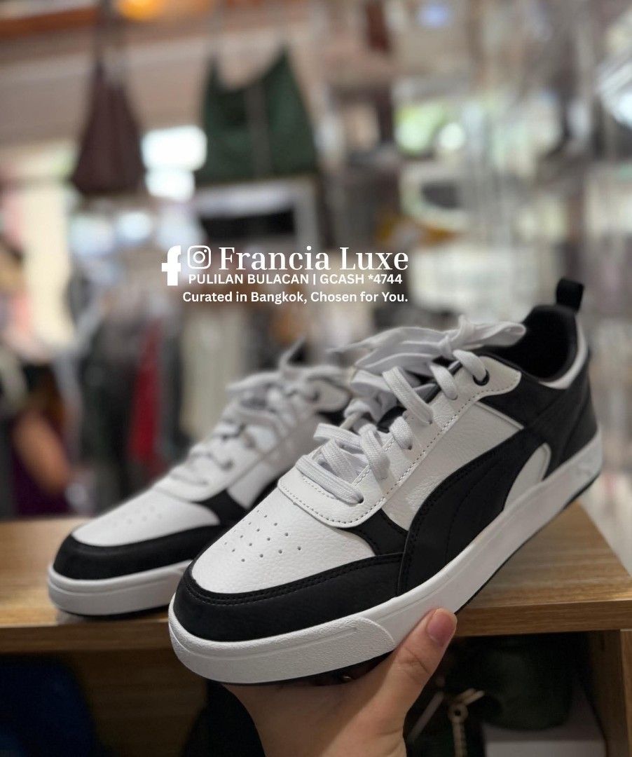 Puma Black and White Sneakers (Category: Sneakers) located in Bulacan. Submitted by francia.luxe_237 (Listing ID 1460595335, Image 3). Description: - Authentic Puma sneakers in black and white - Low-top design - Lace-up closure - Iconic Puma logo on heel and side - Ideal for everyday wear - Comfortable and stylish.