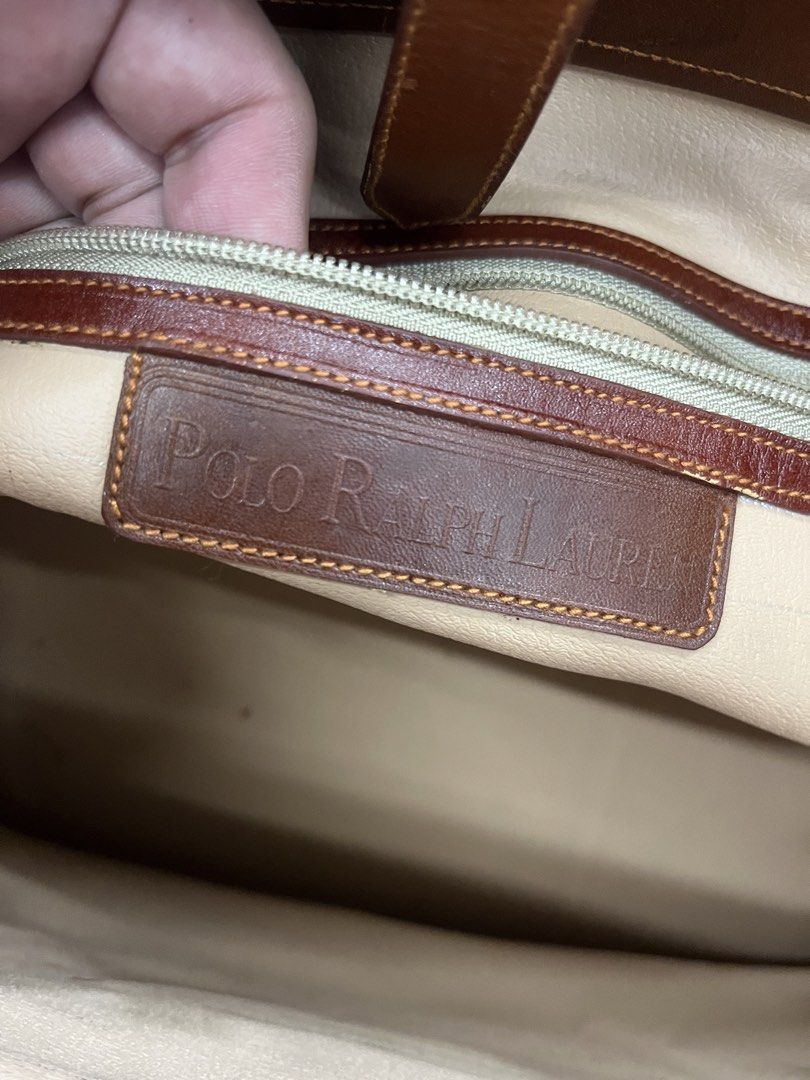 Ralph Lauren (Category: Tote Bags) located in Balete No 2. Submitted by troyesybang (Listing ID 1460697546, Image 3). Description: Vintage flaw see pics sa ilalim ng strap ng lock ng belt crack yun lng Clean on the inside Used Sf to j&t only No hangtag bag only Lp fix.