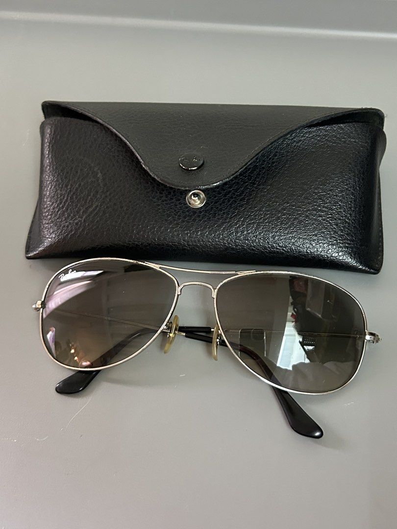 Ray-Ban Aviator Sunglasses with Case (Category: Sunglasses & Eyewear) located in Manila. Submitted by eclipse_2130 (Listing ID 1460528362, Image 1). Description: - Classic Ray-Ban Aviator sunglasses - Silver metal frame - Gradient lenses with a slight tint - Comes with original black leather case - Ideal for everyday wear.