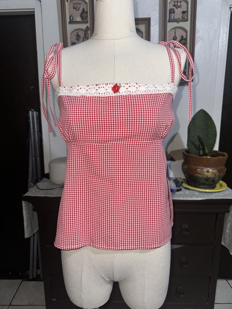 Red Gingham Tie-Strap Crop Top with Lace Trim (Category: Sleeveless) located in Quezon City. Submitted by marshyco (Listing ID 1460638108, Image 1). Description: - Adorable red gingham crop top - Adjustable tie straps for a perfect fit - Pretty lace trim along the bust - Tie back closure with a cute bow Bought this from Huebadera!.