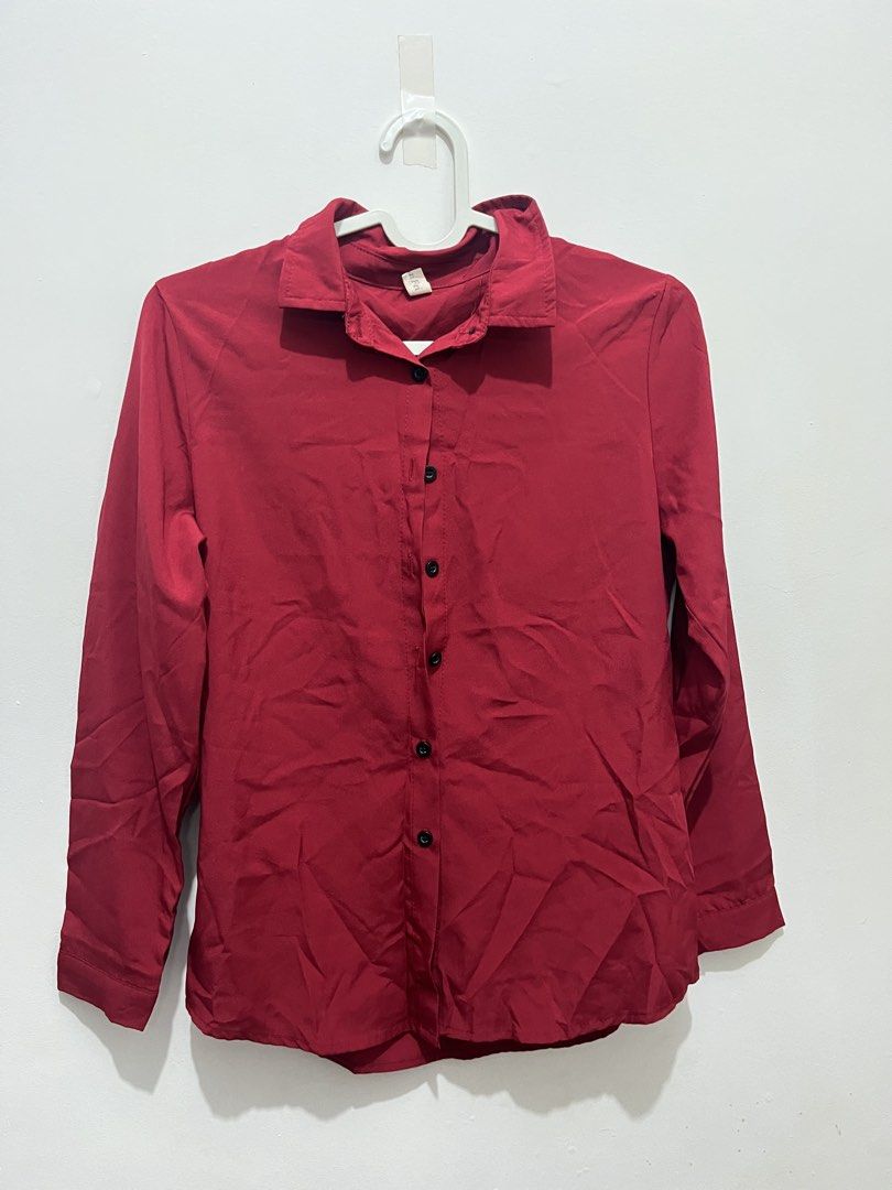 Red Long Sleeve Button Up Shirt (Category: Tshirts & Polo Shirts ) located in Manila. Submitted by jonalainea95245 (Listing ID 1460708119, Image 1). Description: - Classic red long sleeve shirt - Button-up front with black buttons - Lightweight and slightly shiny material RFS: decluttering Location: Malabon.