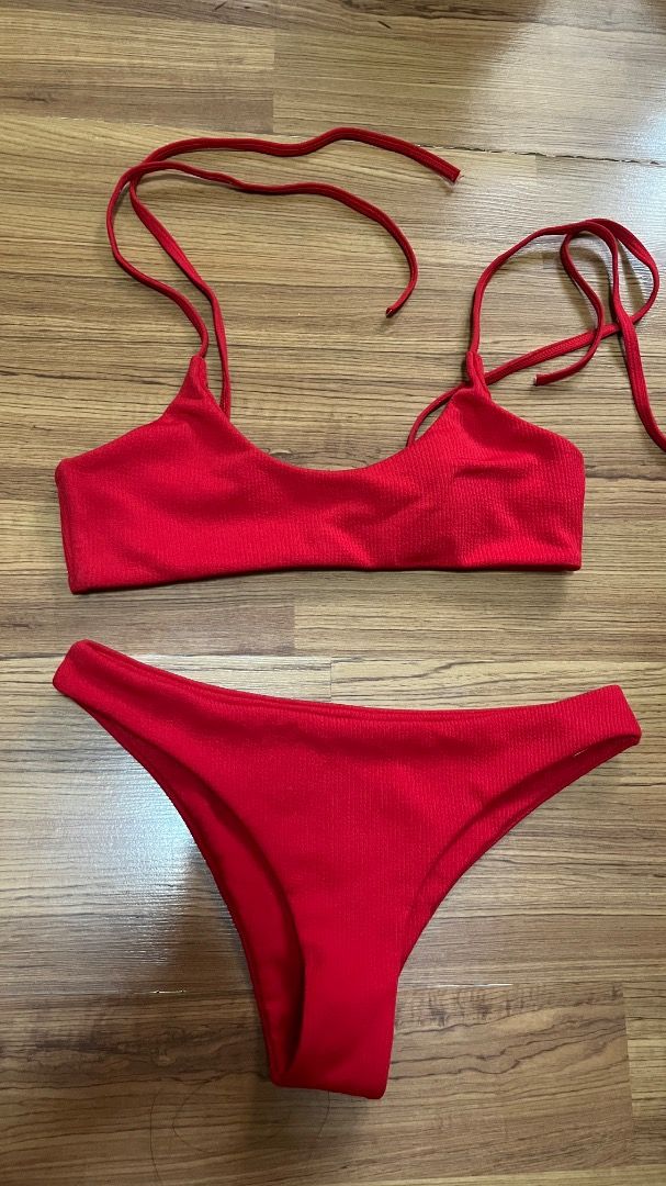 Red Textured Bikini Set with Tie Straps (Category: Bikinis & Swimsuits) located in Taguig. Submitted by fayneayana (Listing ID 1460691141, Image 1). Description: - Vibrant red bikini set - Textured fabric for a stylish look - Top with adjustable tie straps for a perfect fit - Classic bikini cut bottoms - Ideal for beach days, pool parties, or your next vacation.