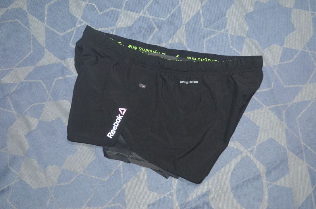 Reebok Running Shorts Size M Preloved (Category: Activewear) located in Polomolok. Submitted by lastthrift (Listing ID 1460562978, Image 1). Description: - Reebok black running shorts - Size: Medium (M) /32-34x11" - Built-in inner brief with a small pocket - "RUN AROUND IT" printed on the waistband - Ideal for running and workouts.