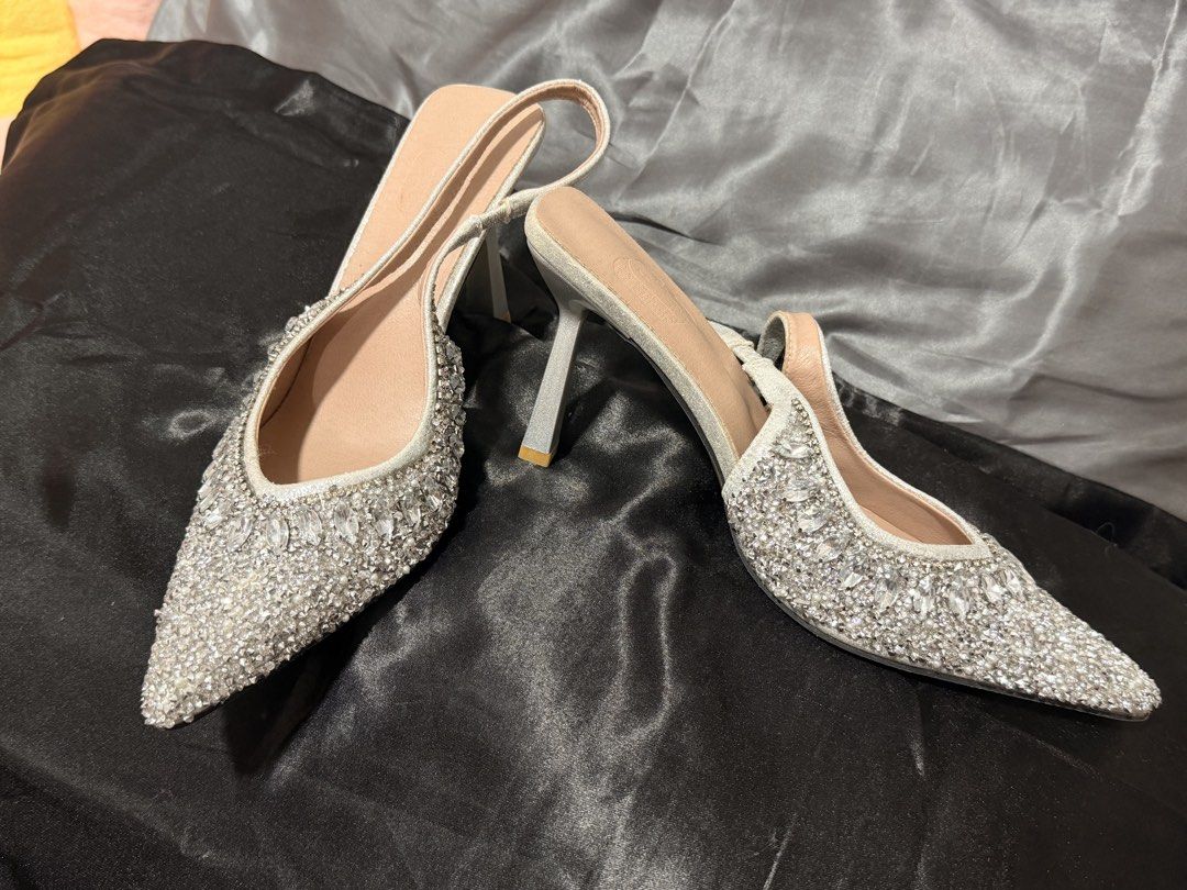 Rhinestone Pointed-Toe Slingback Heels (Category: Heels) located in Mandaluyong City. Submitted by empresskie (Listing ID 1460685178, Image 2). Description: • Rhinestone/crystal embellished design • Pointed toe • Slingback style • Slim high heel • Size: 40 • Very good condition / gently used • Eye-catching and classy .