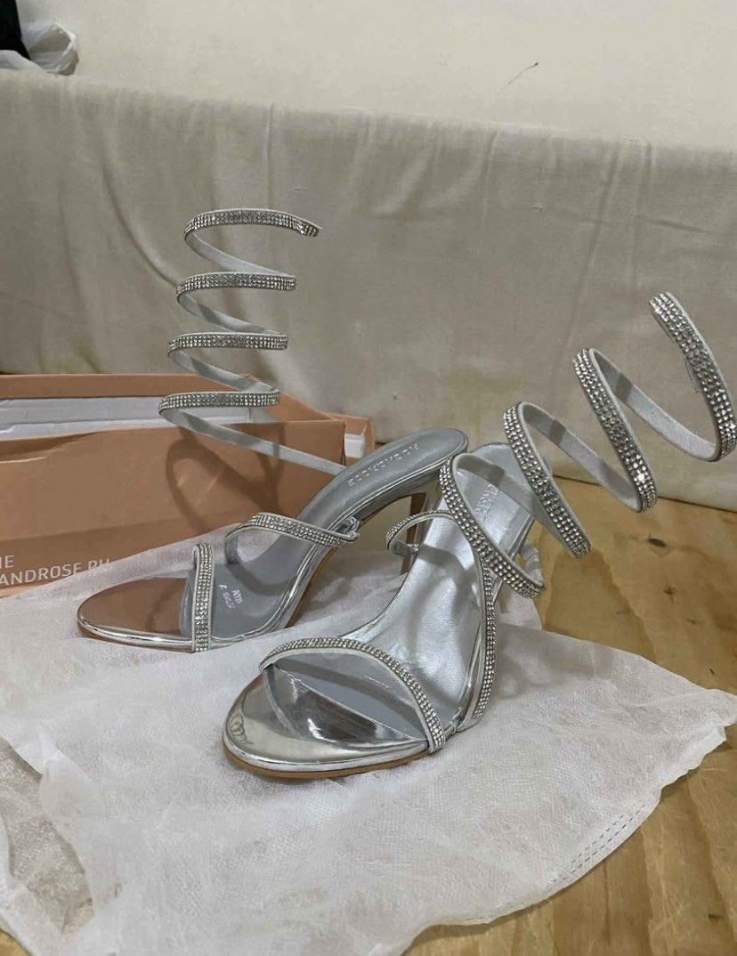 Rock and rose - Glenda (Category: Heels) located in Manila. Submitted by cherryparubrub (Listing ID 1460567001, Image 1). Description: Stunning silver heels with eye-catching rhinestone spiral straps. Only use once, good as new. Size:37 Color:Silver Style:Glenda .