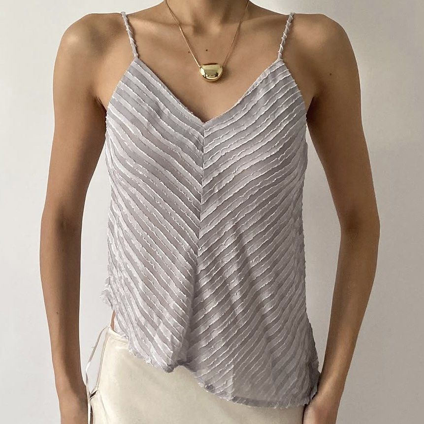 ROCOCO VINTAGE GRAY TEXTURED ASYMMETRICAL TOP (Category: Sleeveless) located in Manila. Submitted by ysamariee (Listing ID 1460637884, Image 1). Description: - Size: XS - S - Diagonal stripe texture - V-neckline with thin spaghetti straps - Asymmetrical hemline - Super flowy and light material - Versatile: wear layered or on its own Location: Las Pinas City Mode of Payment: GCASH, Bank Transfer Mode of Delivery: Lalamove, Same Day Delivery .