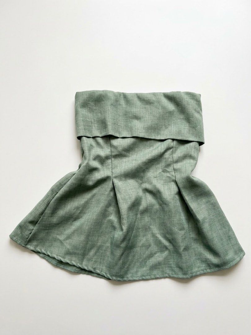 Sage Green Off-Shoulder Pleated Top (Category: Blouses) located in Makati City. Submitted by secondseries (Listing ID 1460542240, Image 1). Description: This is the actual photo. - Only used once to attend a wedding - Sage green off-shoulder top - Features a folded neckline - Pleated flare at the bottom - Subtle textured fabric - Estimated size: Small to Medium (S/M) - Versatile for casual or dressy occasions.