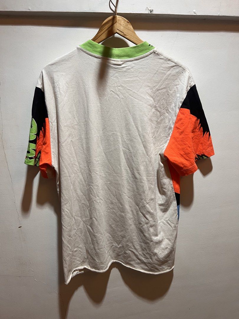 Saint Force Graphic T-Shirt (Category: Tshirts & Polo Shirts ) located in San Juan, La Union. Submitted by jeggystyle (Listing ID 1460526647, Image 2). Description: - Bold graphic tee with 'Saint Force' text design. - Vibrant colors: Orange, black, blue, and green. - Classic short sleeves and crew neck. - Ideal for everyday casual wear. - Features a striking and eye-catching print. Fits large to xl.