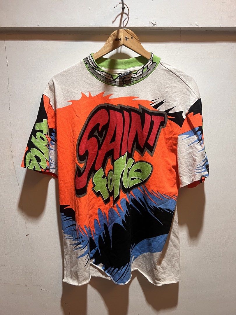 Saint Force Graphic T-Shirt (Category: Tshirts & Polo Shirts ) located in San Juan, La Union. Submitted by jeggystyle (Listing ID 1460526647, Image 1). Description: - Bold graphic tee with 'Saint Force' text design. - Vibrant colors: Orange, black, blue, and green. - Classic short sleeves and crew neck. - Ideal for everyday casual wear. - Features a striking and eye-catching print. Fits large to xl.