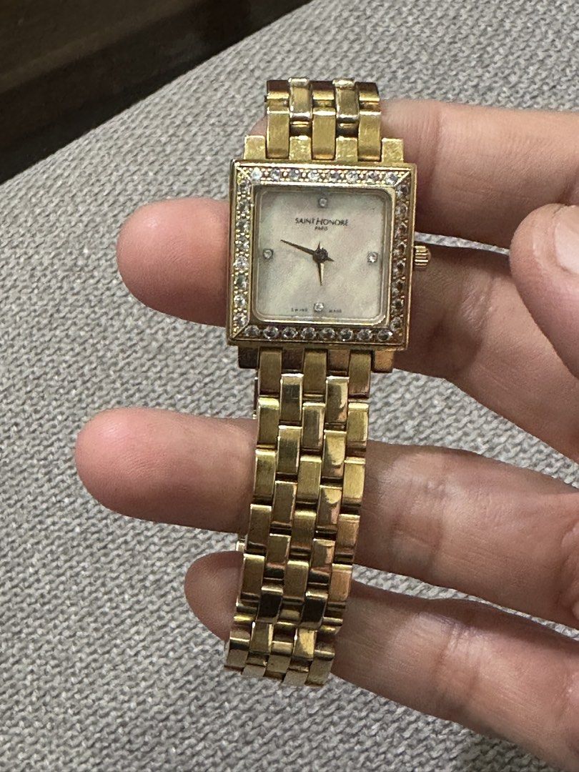 Saint Honore Paris Square Watch with Real Diamond Bezel (Category: Women's Watches) located in Manila. Submitted by roseluxuryitems (Listing ID 1460607477, Image 3). Description: - Brand: Saint Honore Paris - Case & Bracelet: Gold-tone - Dial: Mother-of-pearl - Markers: Diamonds - Bezel: Diamond-encrusted - Swiss made .