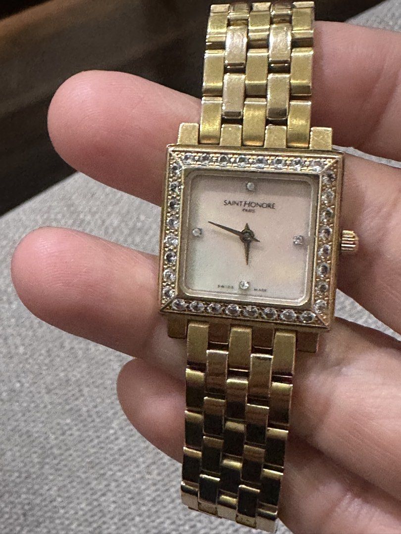 Saint Honore Paris Square Watch with Real Diamond Bezel (Category: Women's Watches) located in Manila. Submitted by roseluxuryitems (Listing ID 1460607477, Image 1). Description: - Brand: Saint Honore Paris - Case & Bracelet: Gold-tone - Dial: Mother-of-pearl - Markers: Diamonds - Bezel: Diamond-encrusted - Swiss made .