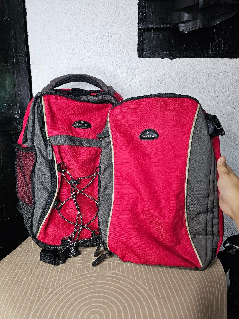 Samsonite multi-functional travel backpack (Category: Backpacks) located in Baguio. Submitted by kayeonlineshop (Listing ID 1460572245, Image 2). Description: Samsonite multi-functional travel backpack configuration featuring a distinct red and textured grey colorway. Key Features: Modular 2-in-1 Design: This model features a detachable lower compartment or matching packing/toiletry cell that integrates into the face or base of the main backpack 