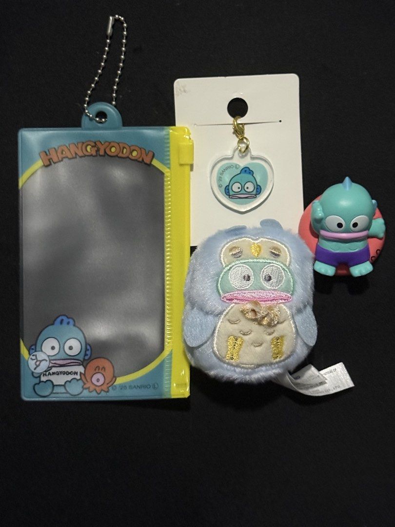 Sanrio Hangyodon Assorted Items (Category: Character Goods) located in Mandaluyong City. Submitted by myeonii.e (Listing ID 1460679065, Image 1). Description: Assorted Hangyodon Items! All brand new, only plushie with original box. Bundle Price: 450 Individual Prices: - Fastener Case (₱75, original price ₱98) - Acrylic Charm (₱50, original price ₱98) - Gacha Figure (₱195, original price ₱260) - Plush Charm (₱300, original price ₱650) Feel free to