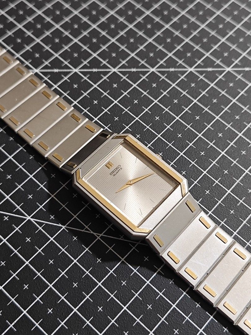 Seiko Quartz Rectangle Watch Two-Tone Gold Silver (Category: Luxury Watches) located in Makati City. Submitted by reyf86 (Listing ID 1460540914, Image 3). Description: - Classic Seiko Quartz watch - Two-tone design: Silver-tone bracelet with elegant gold accents - Rectangular face for a clean, timeless look - Secure fold-over clasp - Shows some signs of wear on metal links, adding character - Ideal for everyday wear.