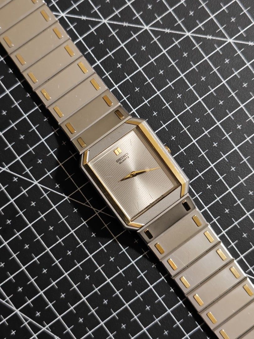 Seiko Quartz Rectangle Watch Two-Tone Gold Silver (Category: Luxury Watches) located in Makati City. Submitted by reyf86 (Listing ID 1460540914, Image 1). Description: - Classic Seiko Quartz watch - Two-tone design: Silver-tone bracelet with elegant gold accents - Rectangular face for a clean, timeless look - Secure fold-over clasp - Shows some signs of wear on metal links, adding character - Ideal for everyday wear.