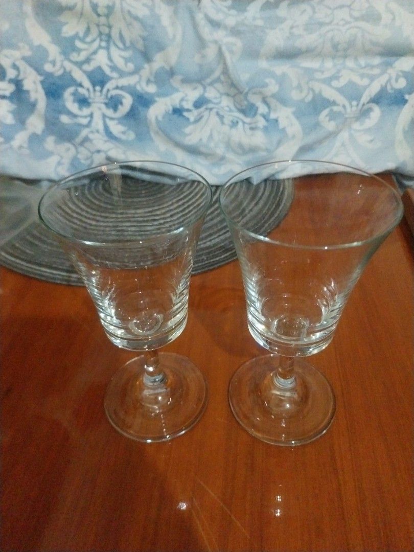 Set of 2 Clear Wine Glasses (Category: Dinnerware & Cutlery) located in Paranaque City. Submitted by riccsmars (Listing ID 1460555596, Image 2). Description: - Set of two clear wine glasses - Classic stemmed design - Versatile for wine or other beverages - Ready for a new home.