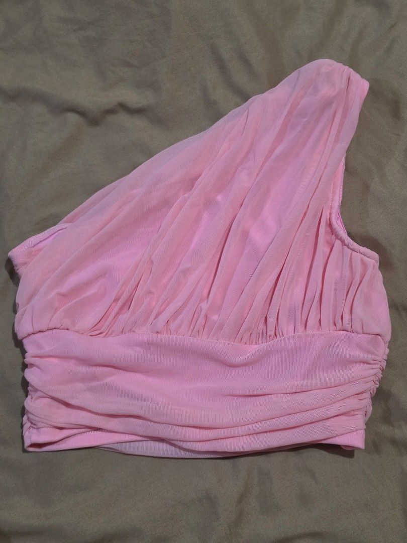SHEIN MOD Pink Ruched One-Shoulder Crop Top (Category: Blouses) located in Malabon City. Submitted by lpzangie (Listing ID 1460599522, Image 2). Description: - SHEIN MOD pink ruched one-shoulder crop top - Asymmetrical neckline - Stretchy material with all-over ruching - Banded hem - Ideal for nights out or special occasions - Pairs well with high-waisted pants or skirts.