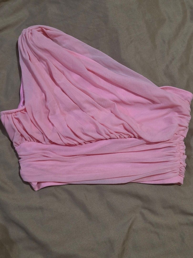 SHEIN MOD Pink Ruched One-Shoulder Crop Top (Category: Blouses) located in Malabon City. Submitted by lpzangie (Listing ID 1460599522, Image 3). Description: - SHEIN MOD pink ruched one-shoulder crop top - Asymmetrical neckline - Stretchy material with all-over ruching - Banded hem - Ideal for nights out or special occasions - Pairs well with high-waisted pants or skirts.