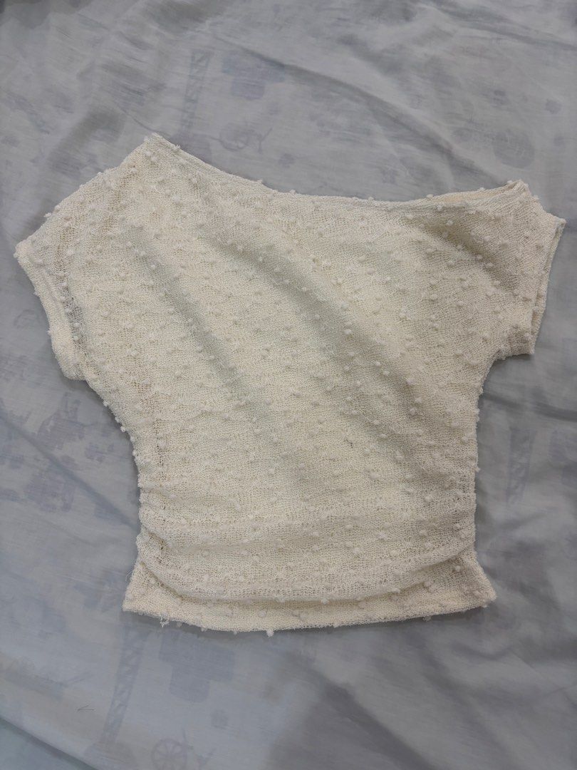 shein off white one side shoulder top with details (Category: Others Tops) located in Manila. Submitted by kartlhs (Listing ID 1460654273, Image 1). Description: - Off-white textured one-shoulder top - Slim fit with short sleeves - Asymmetrical neckline - Ruched detail on the side - Ideal for summer brunch or casual outings - Pairs well with jeans.