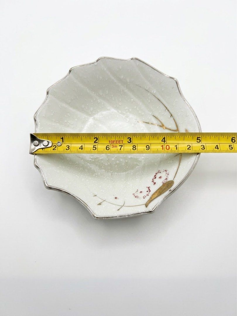 Shell shaped small bowl (Category: Other Kitchenware & Tableware) located in Manila. Submitted by rlab_japan_thrift (Listing ID 1460588917, Image 3). Description: Japanese Vintage Shell-Shaped Ceramic Bowl Set (Set of 3) 🐚🌸✨ Charming set of small Japanese ceramic dishes featuring a textured shell fan design, delicate pink floral accents, gold detailing, and a silver-toned scalloped rim. Perfect for serving desserts, appetizers, fruit, or side d