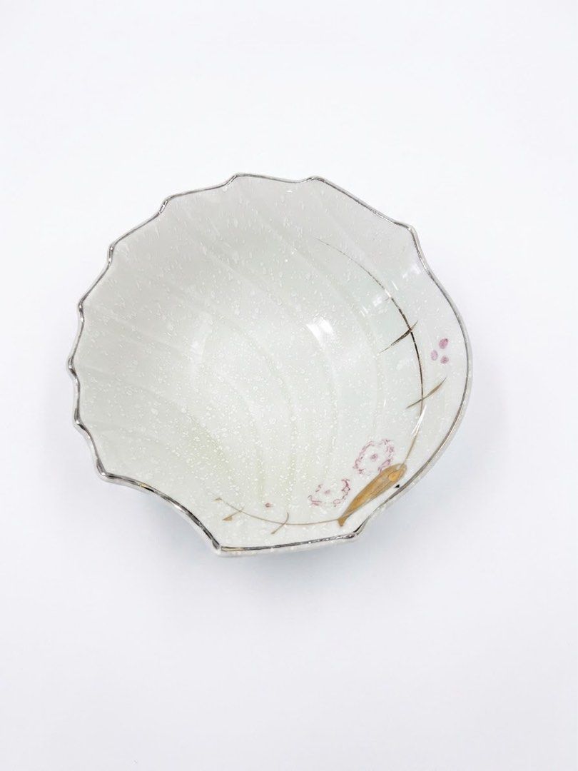 Shell shaped small bowl (Category: Other Kitchenware & Tableware) located in Manila. Submitted by rlab_japan_thrift (Listing ID 1460588917, Image 1). Description: Japanese Vintage Shell-Shaped Ceramic Bowl Set (Set of 3) 🐚🌸✨ Charming set of small Japanese ceramic dishes featuring a textured shell fan design, delicate pink floral accents, gold detailing, and a silver-toned scalloped rim. Perfect for serving desserts, appetizers, fruit, or side d