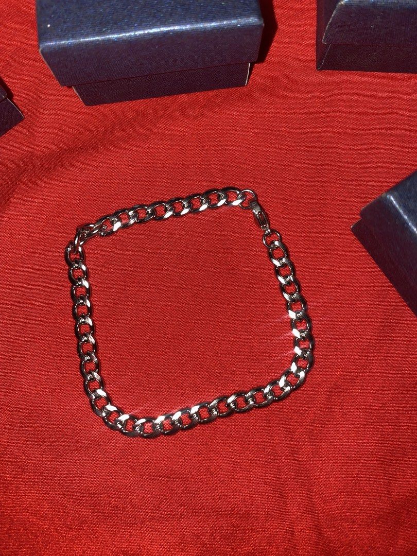 Silver Curb Chain Bracelet with Clasp (Category: Bracelets) located in Mandaluyong City. Submitted by dabidd75841 (Listing ID 1460586321, Image 1). Description: - Classic silver curb chain design - Secure clasp closure for peace of mind - Versatile: wear it alone or layer with other jewelry - Comes with a stylish dark blue jewelry box.
