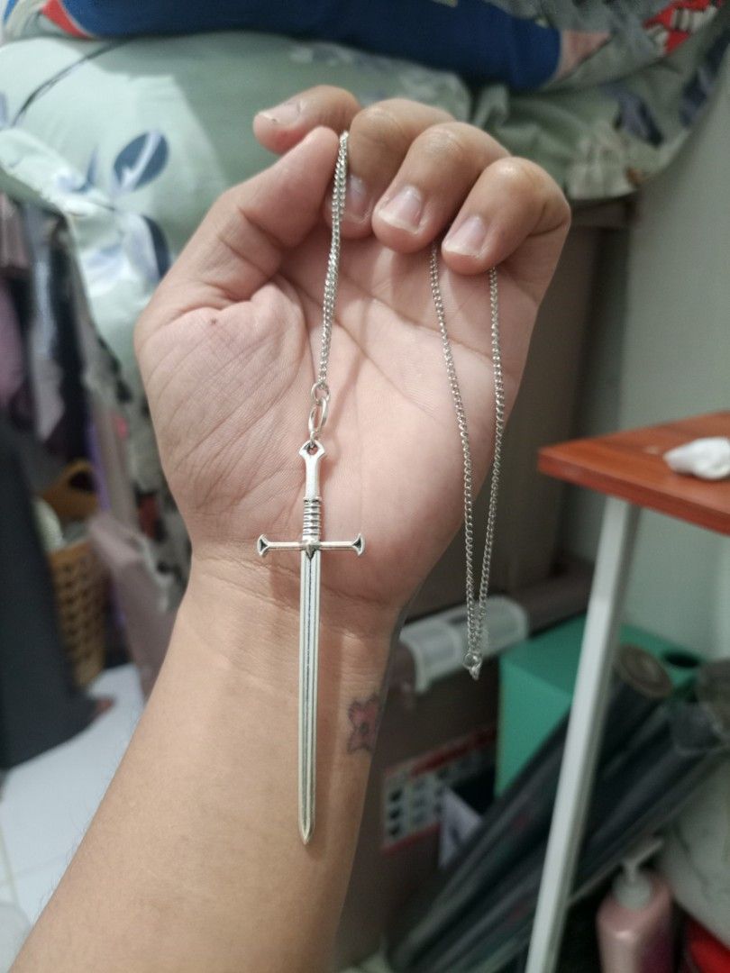 Silver Sword Pendant Necklace (Category: Necklaces) located in Manila. Submitted by warmcrystal_269010 (Listing ID 1460561836, Image 3). Description: - Cool sword pendant necklace - Includes silver chain - Adds a unique touch to your outfit - Simple and stylish design - Perfect for gifting or personal wear.