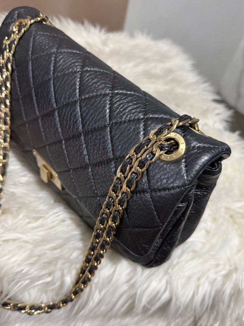 Sisley Chain Sling Bag (Category: Shoulder Bags) located in Marikina City. Submitted by welllovedbycarina (Listing ID 1460548180, Image 3). Description: Original Sisley, preowned from Korea Color in actual is metallic dark grey, ang unique ✨ The strap is convertible from shoulder to crossbody length Gold tone hardware Ready to ship from Marikina City Small size Dimensions: 29cm x 15cm x 7cm BAG CONDITION • Overall Condition: Excellent • Leather/M