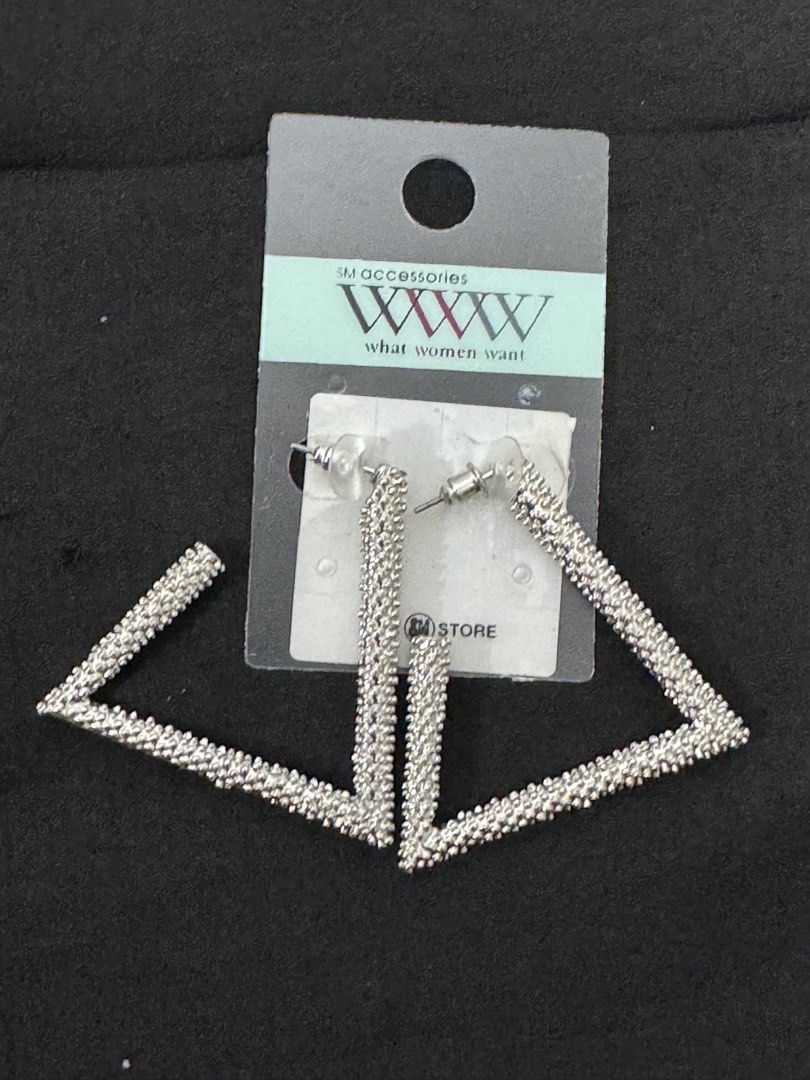 SM Accessories Silver Triangle Dangle Earrings (Category: Earrings) located in Pasig City. Submitted by tinylittlestore (Listing ID 1460714704, Image 2). Description: - Brand: SM Accessories - Style: Silver triangle earrings - Features: Textured, beaded look - Closure: Post back - Perfect for: Statement earrings for any outfit - Condition: Selling as a pair.