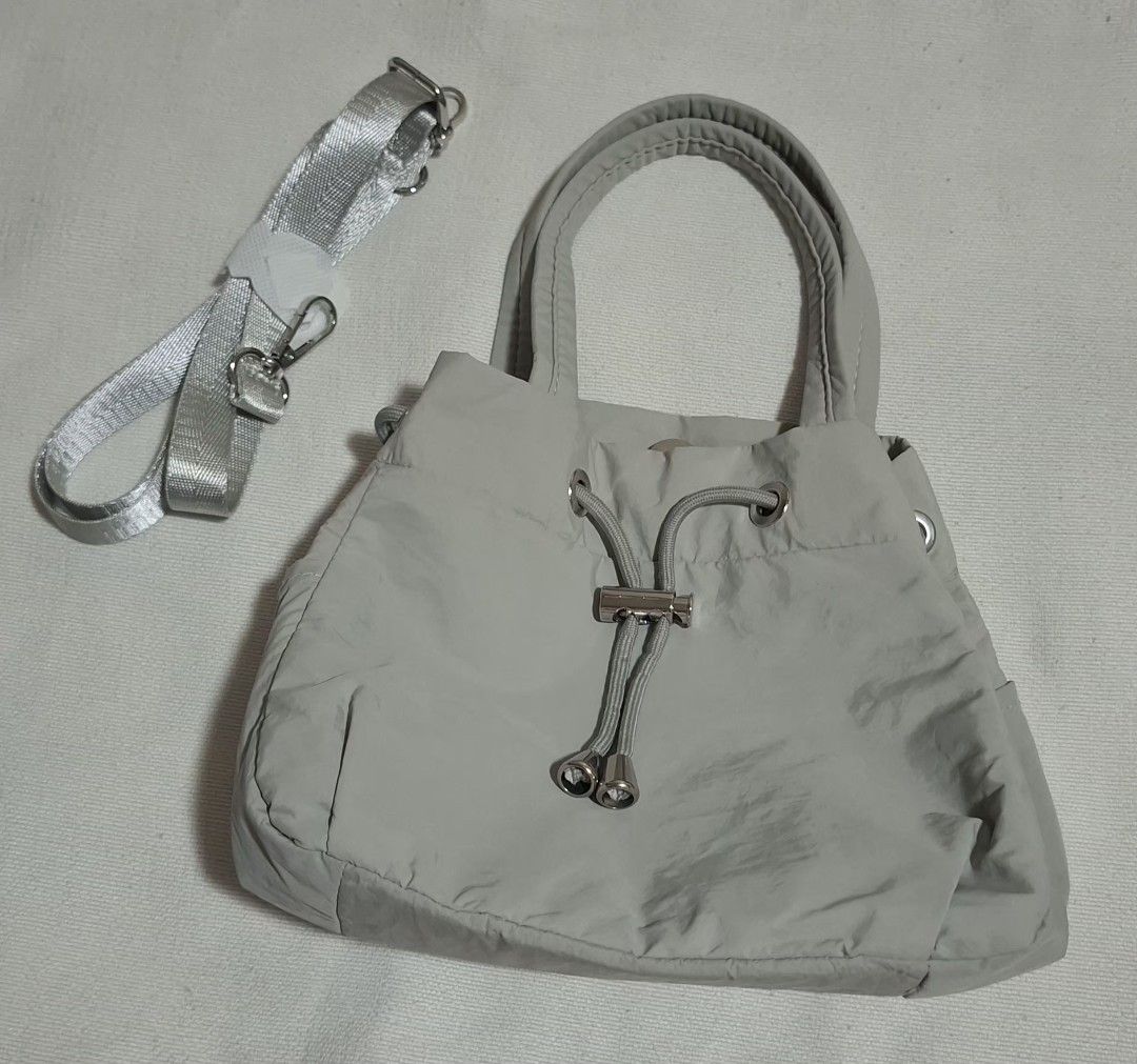 SM Store Shoulder/Hand Bag – Pre-owned (Category: Shoulder Bags) located in Quezon City. Submitted by MP_Declutters (Listing ID 1460651050, Image 1). Description: Original price: ₱499 Pre-owned and still in good condition. Comes with adjustable/removable shoulder strap, handles, drawstring closure, and inner compartments. No major damage. material: nylon/ Polyester fabric RFS: Decluttering..