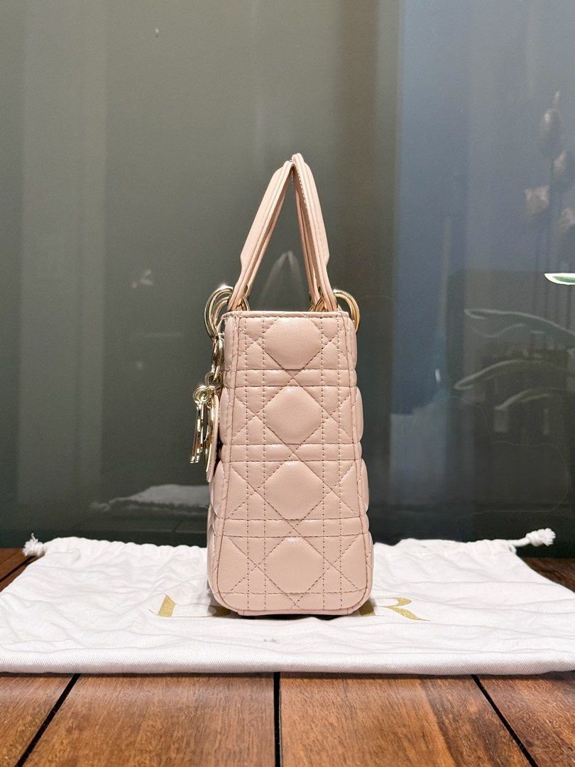 Dior | Lady Dior Small (Category: Cross-body Bags) located in Pasay City. Submitted by ynnangbayan (Listing ID 1460636979, Image 3). Description: Lady Dior 🌸 • Powder Pink Cannage Lambskin • Pale Gold Hardware • Small (8in x 7in x 3in) • Fits wallet, phone, sunglasses • Inclusion: Bag and dust bag only Well used but super pretty in actual Issue: Scuffing from normal use, scratches on the hardwares, no strap ❌ Slightly negotiable DM for more info