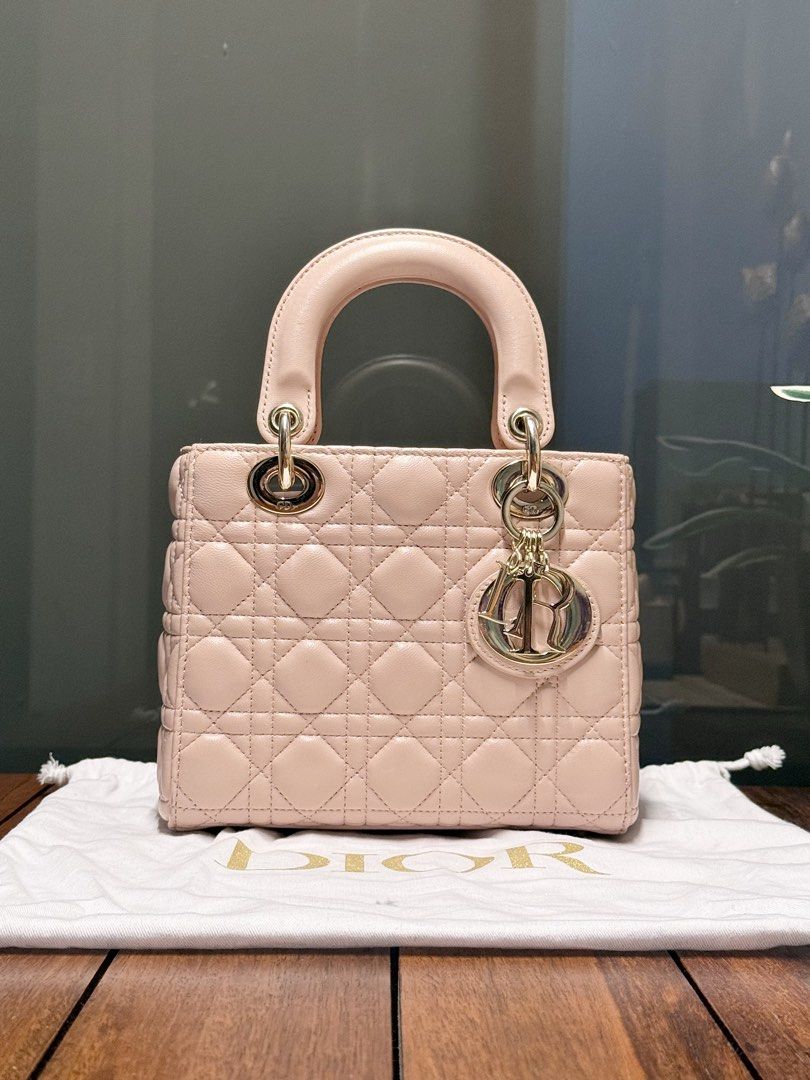 Dior | Lady Dior Small (Category: Cross-body Bags) located in Pasay City. Submitted by ynnangbayan (Listing ID 1460636979, Image 1). Description: Lady Dior 🌸 • Powder Pink Cannage Lambskin • Pale Gold Hardware • Small (8in x 7in x 3in) • Fits wallet, phone, sunglasses • Inclusion: Bag and dust bag only Well used but super pretty in actual Issue: Scuffing from normal use, scratches on the hardwares, no strap ❌ Slightly negotiable DM for more info