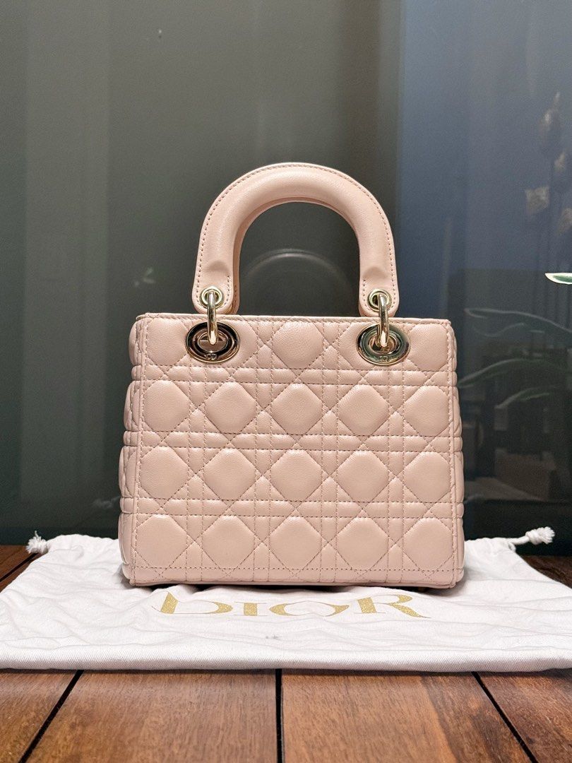 Dior | Lady Dior Small (Category: Cross-body Bags) located in Pasay City. Submitted by ynnangbayan (Listing ID 1460636979, Image 2). Description: Lady Dior 🌸 • Powder Pink Cannage Lambskin • Pale Gold Hardware • Small (8in x 7in x 3in) • Fits wallet, phone, sunglasses • Inclusion: Bag and dust bag only Well used but super pretty in actual Issue: Scuffing from normal use, scratches on the hardwares, no strap ❌ Slightly negotiable DM for more info