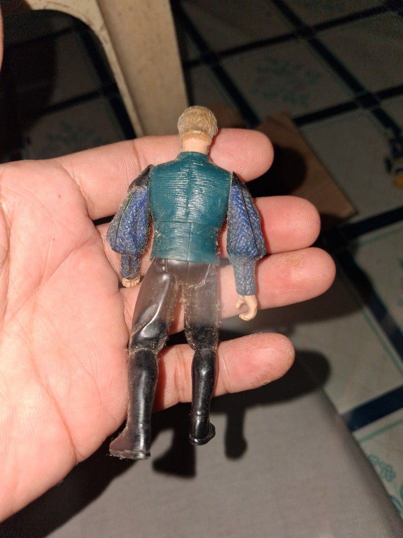 Star Wars Senator Palpatine Hasbro 1999 (Category: Figurines & Statues) located in Manila. Submitted by marcas022798212 (Listing ID 1460629907, Image 2). Description: - Old school action figure - Resembles a military officer - Features a blue jacket with gold buttons and purple accents - Wears black pants and boots - Shows some dust, typical for vintage items - Ideal for collectors or display purposes.