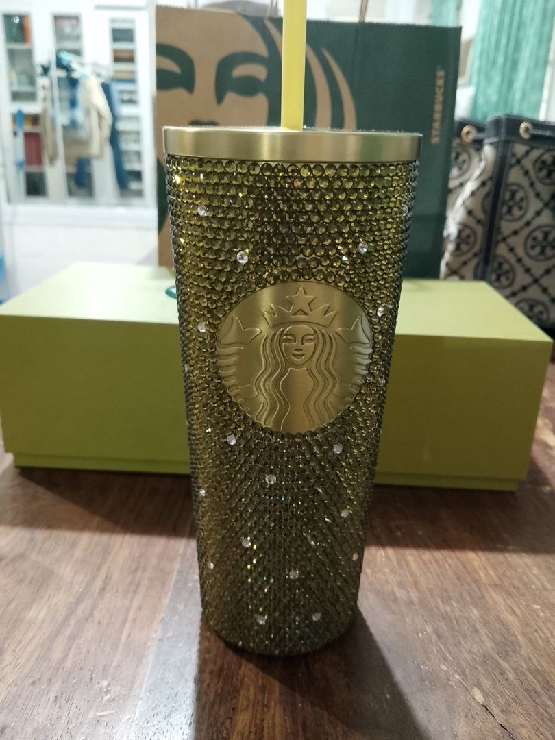 STARBUCKS RHINESTONE TUMBLER (Category: Water Bottles & Tumblers) located in Manila. Submitted by prelovedwearshop (Listing ID 1460647989, Image 2). Description: - original price: 7495 - size: 20oz - brand new, never been used - small dent on the lid (shown in photo) - missing gemstones at the bottom (shown in photo).