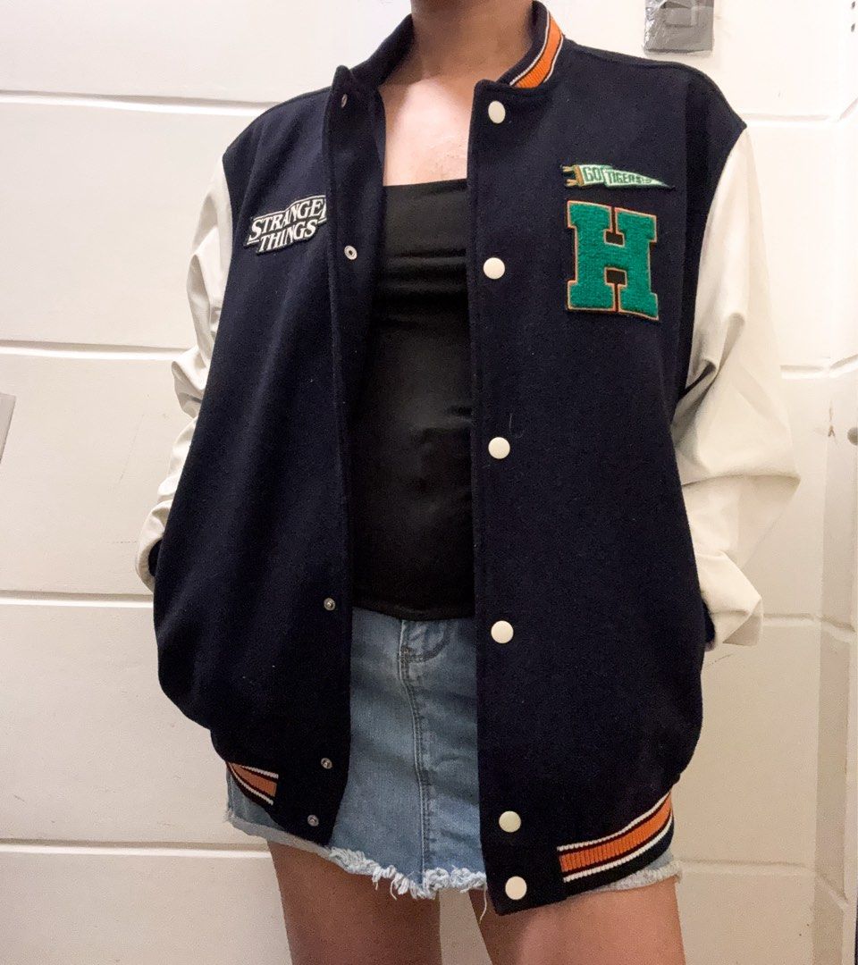Stranger Things "H" Varsity Bomber Jacket (Category: Coats, Jackets and Outerwear) located in Manila. Submitted by jemmmandes (Listing ID 1460569078, Image 1). Description: - Cool Stranger Things varsity bomber jacket - Model Size: Small Body Frame.