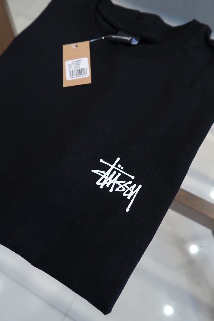 Stüssy Basic Tee (Category: Tshirts & Polo Shirts ) located in Caloocan City. Submitted by cobiray (Listing ID 1460595013, Image 2). Description: Classic black Stussy tee. Features the iconic white Stussy logo on the front and back. Great for casual wear. Comes with original tags attached. Color: Black Size: L — 23” × 29” Price: ₱5,000.
