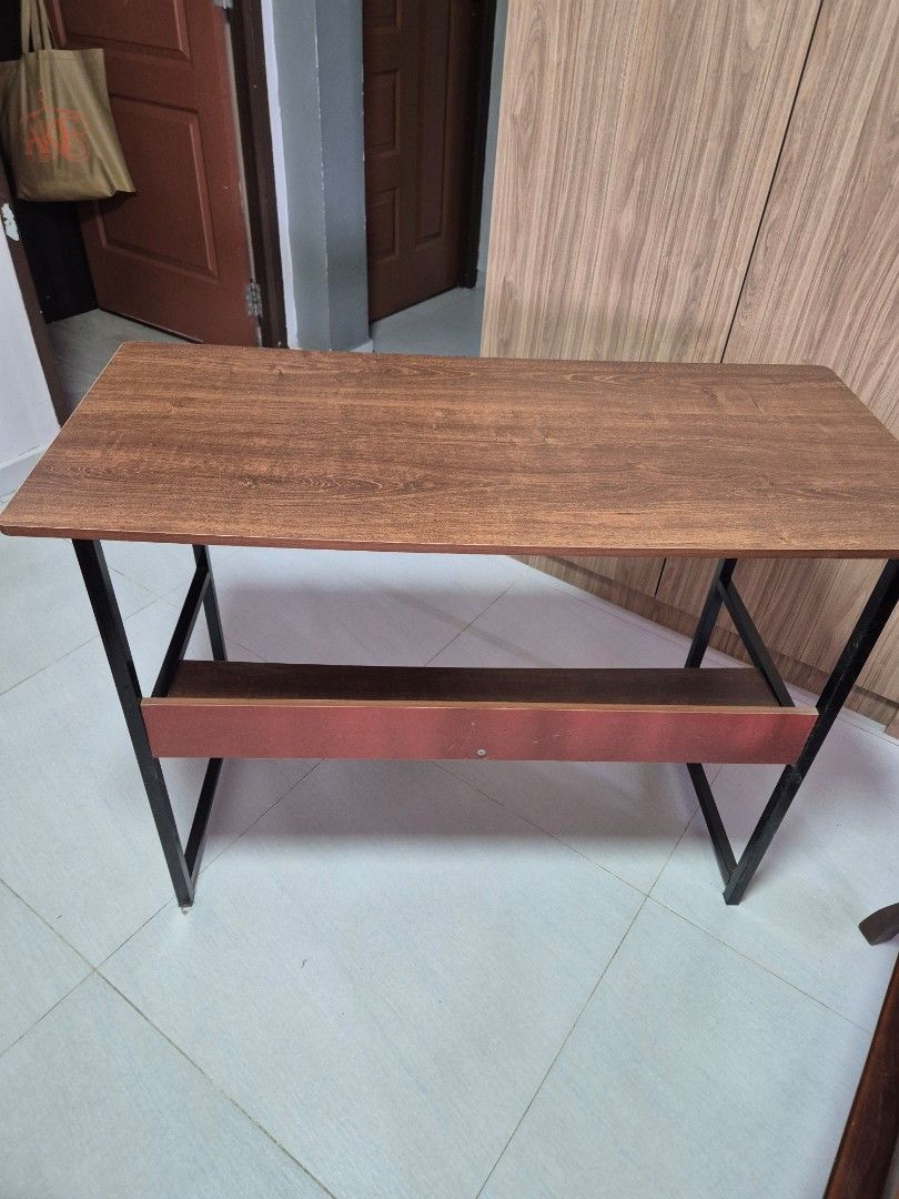 Study Table (Category: Tables & Sets) located in Singapore. Submitted by by.iman (Listing ID 1460546753, Image 3). Description: Study table to bless. Still in good condition. About 1m in length. Standard height. Need to tighten the screws so it will balance. Slightly rocky now. Will not dismantle. 70cm by 45cm by 100cm You need own manpower and own trsnsport..